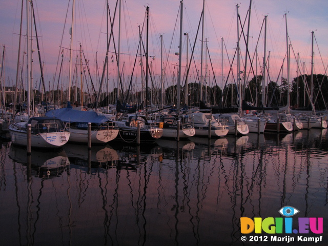 SX24535 Sunset over sailboats in marina at Brouwershaven